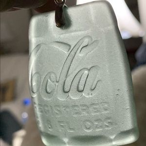 Coca Cola Enhancer Cut from Coca Cola bottle.